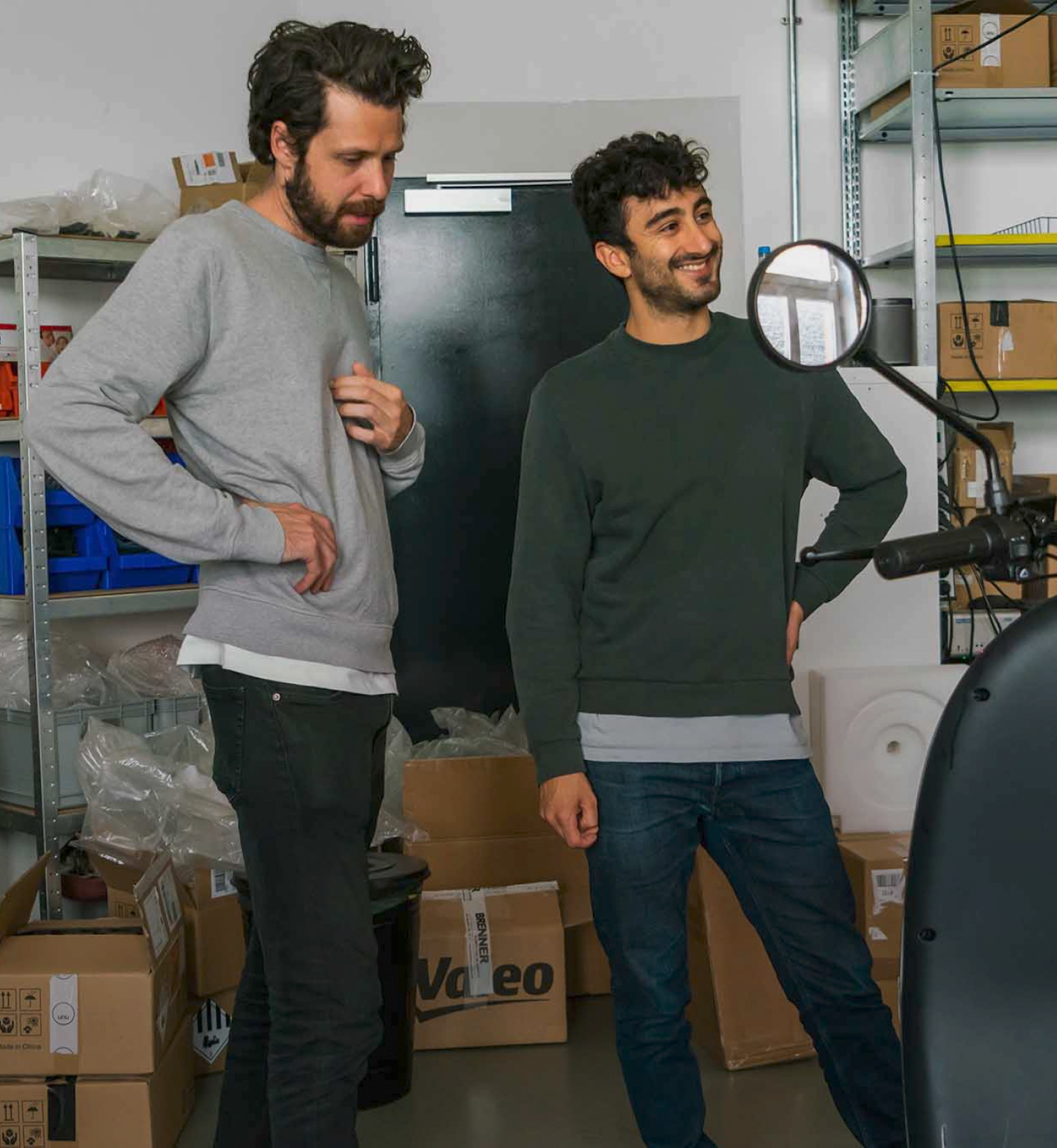 Two persons in storage room