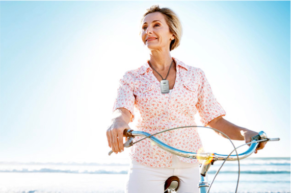 Woman on bike with Lively Mobile Plus