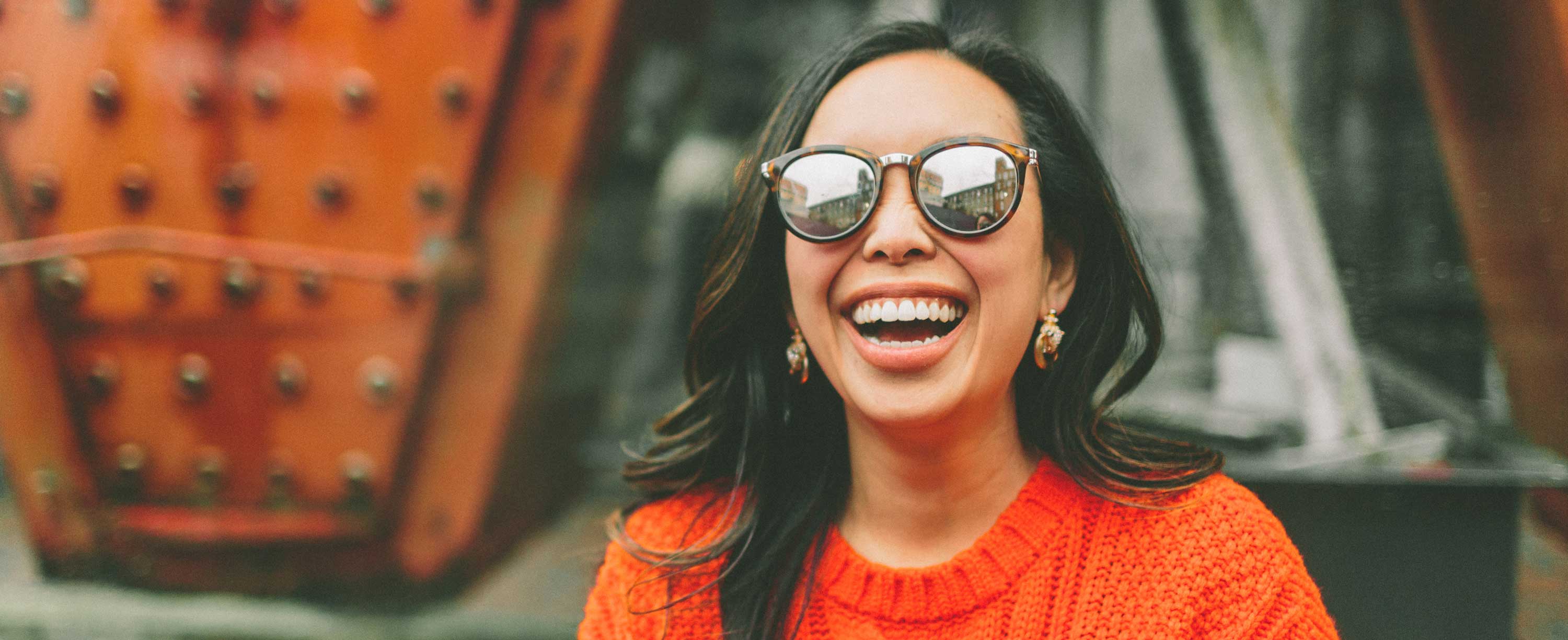 happy smiling woman wearing sunglasses