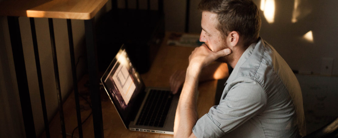 man focused on work at home office