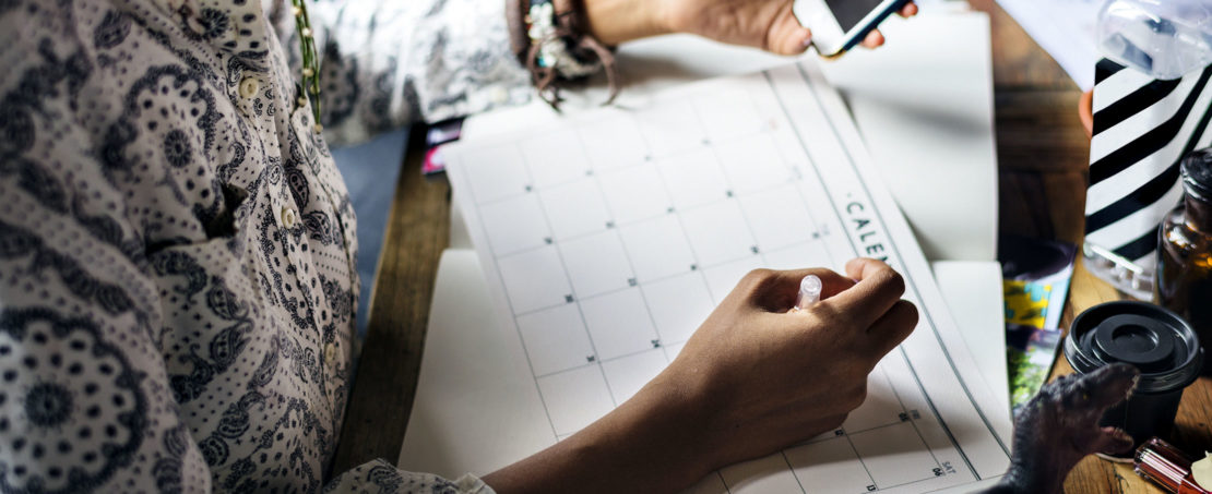 hand writing on calendar on desk