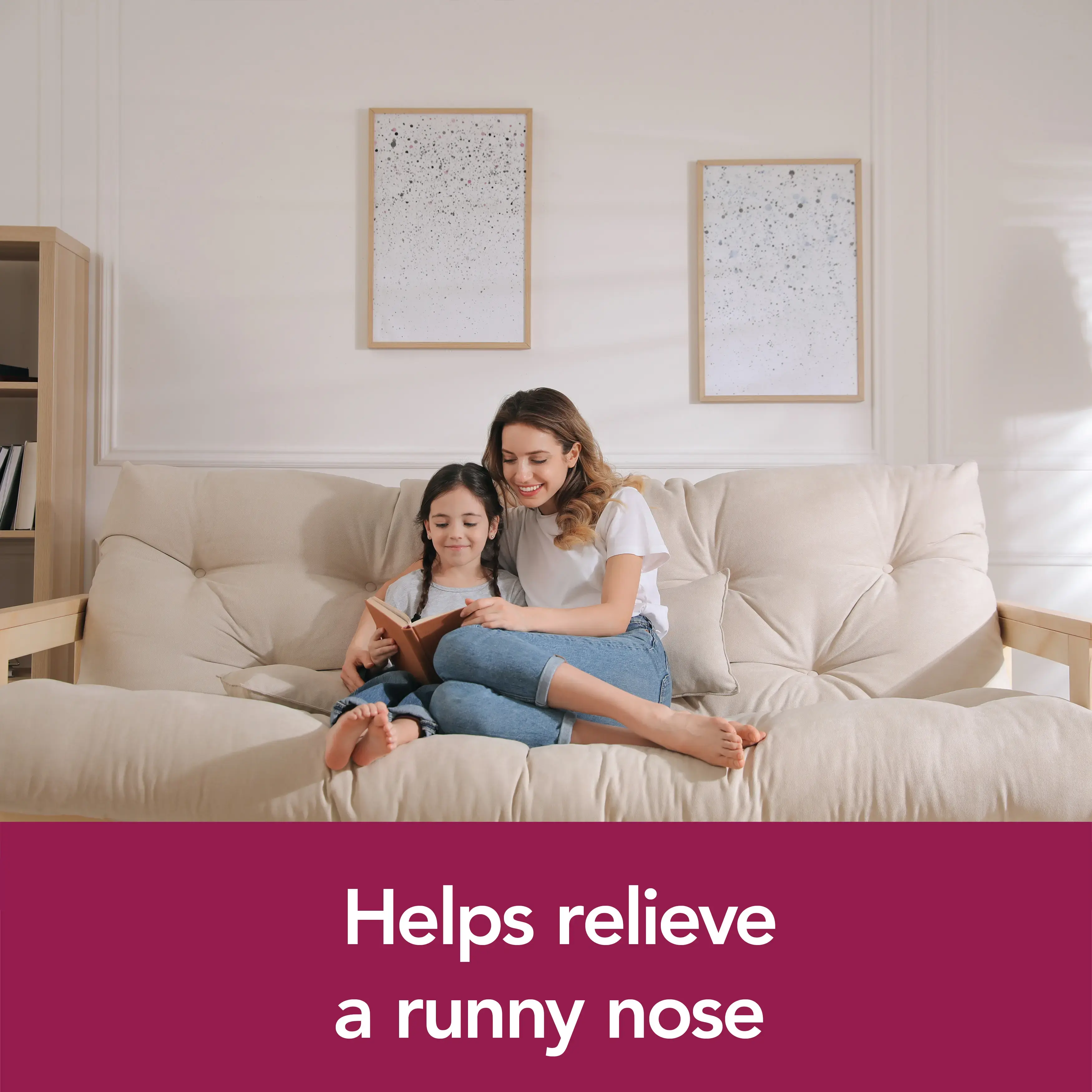 Image showing a mom and her daughter reading with the claim: Helps relieve a runny nose