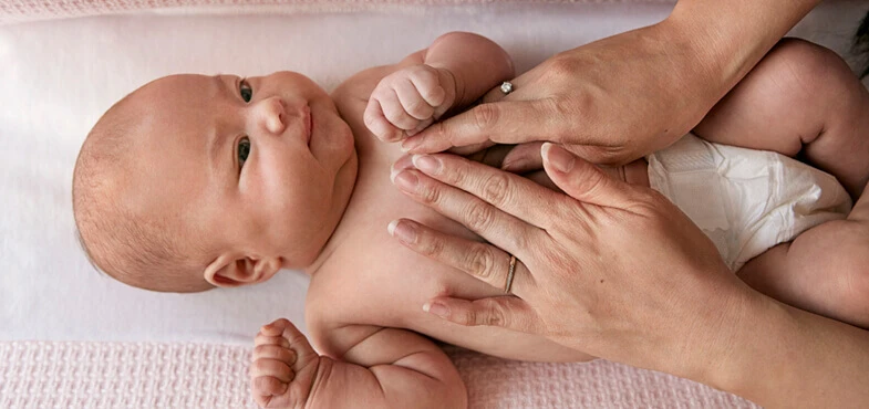 parent giving baby massage