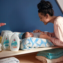 mother leaning over child