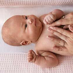 parent giving baby massage