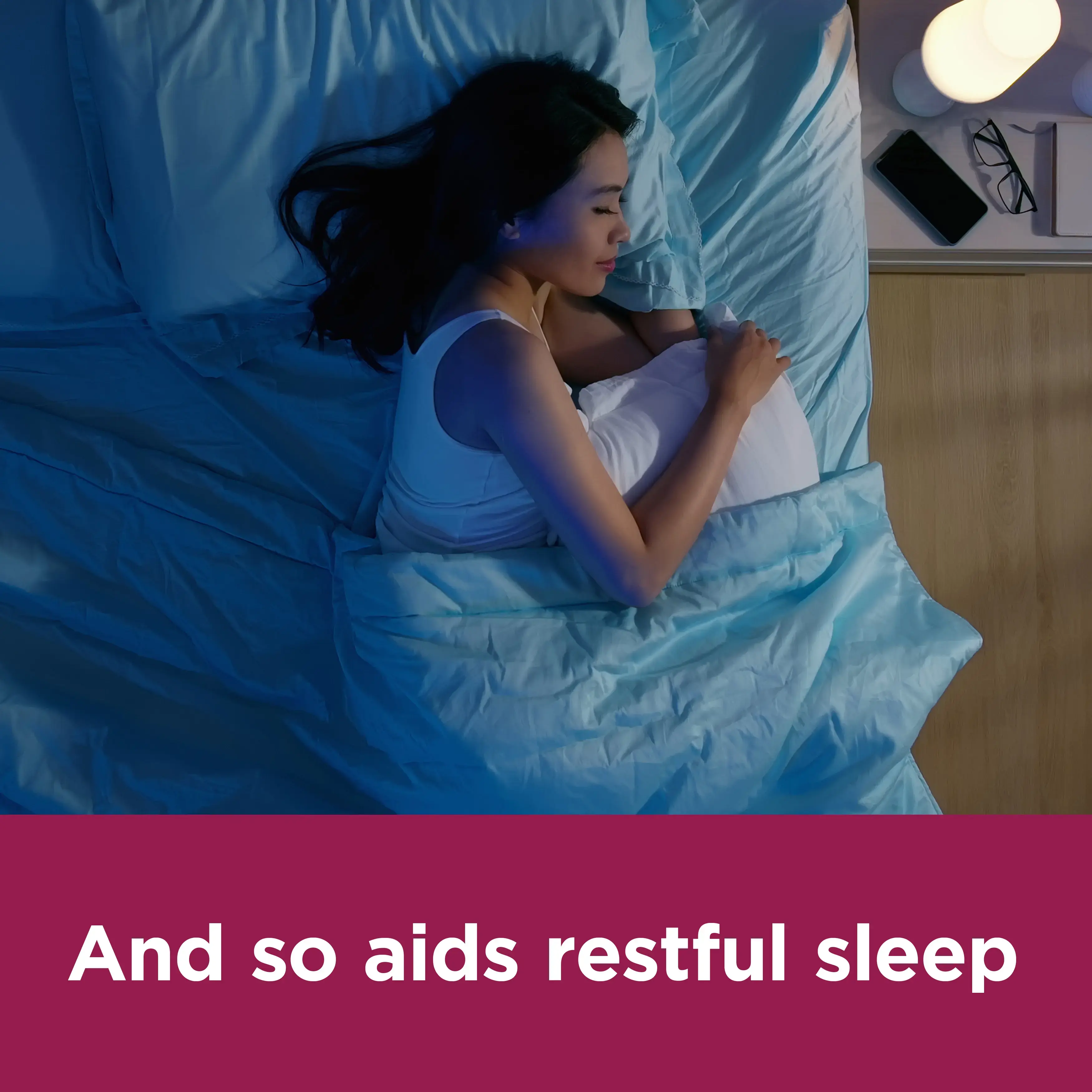 Image of a woman slepping with the claim: And so aids restful sleep 