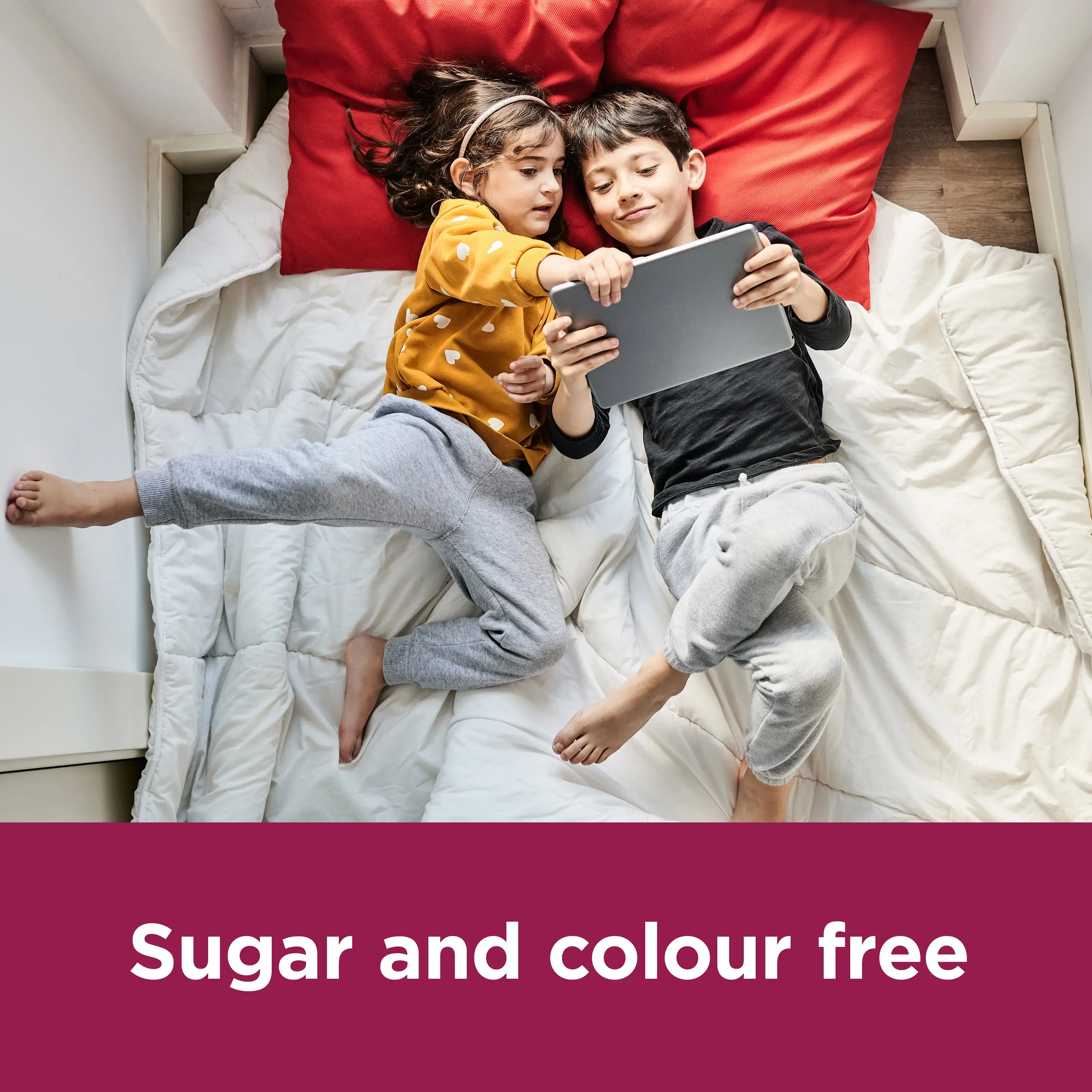Image showing two kids with and ipad with the claim: Sugar and colour free
