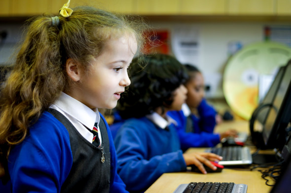 Primary school children working on computers