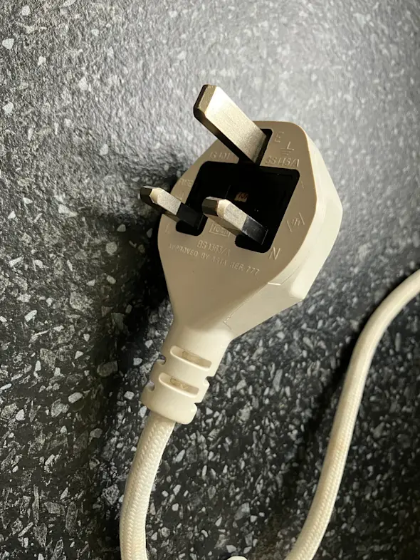 A photograph of a UK 3 pin plug, type G.