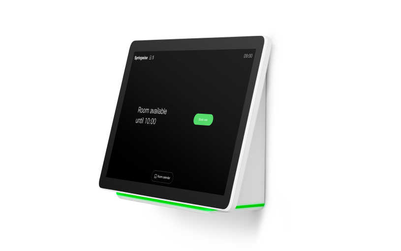 An image of the wall mounted version of the Cisco Webex Navigator on its own. The image shows the front of the device displaying the text "Room available until 10:00, book now".