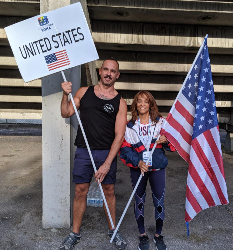 Shelley Keeling and Carl Anhalt carry the American flag at the opening of the Eurogames 2019.