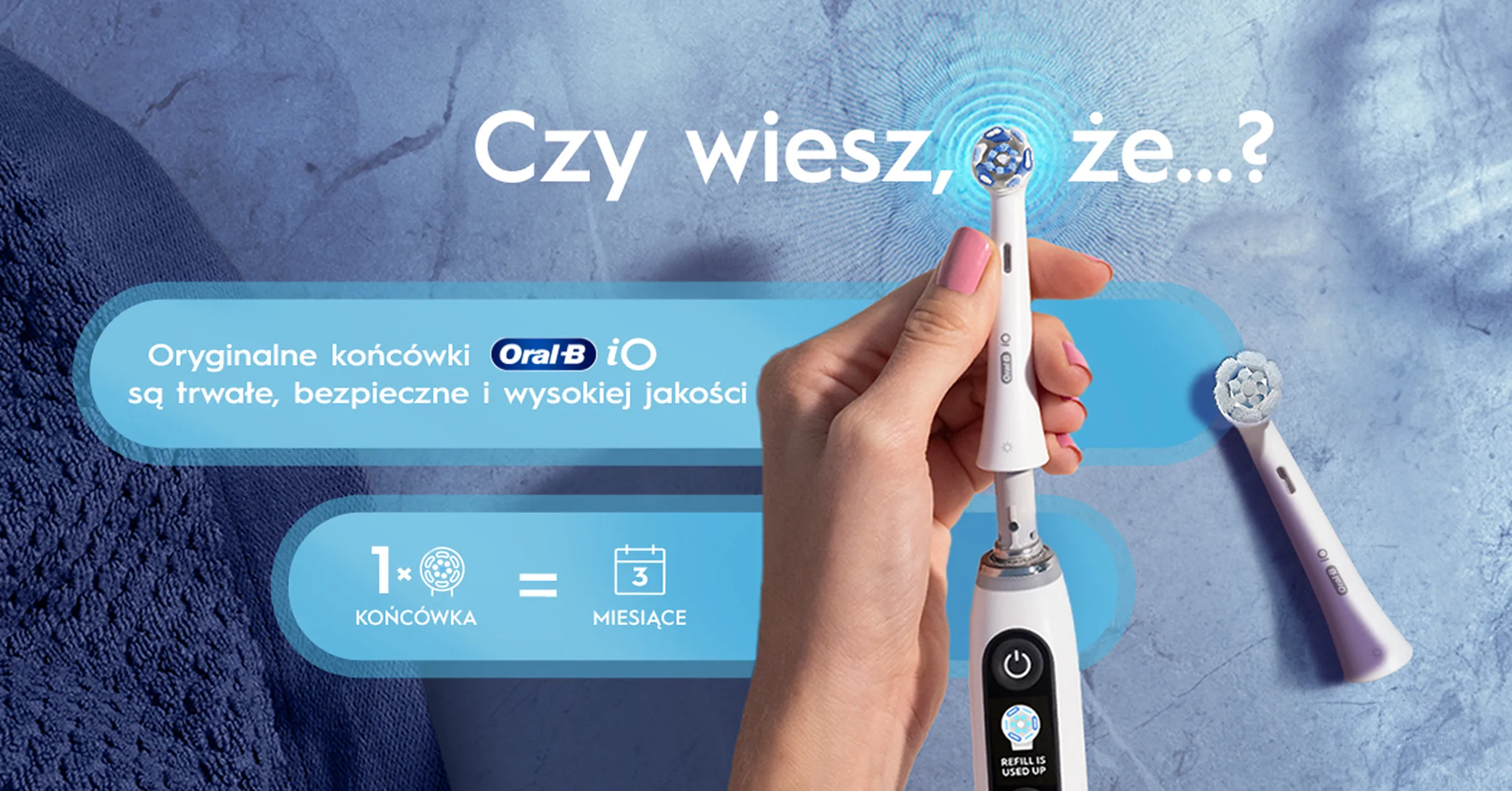 Dłoń trzymająca końcówkę szczoteczki Oral-B iO, którą można używać nawet przez 3 miesiące. 