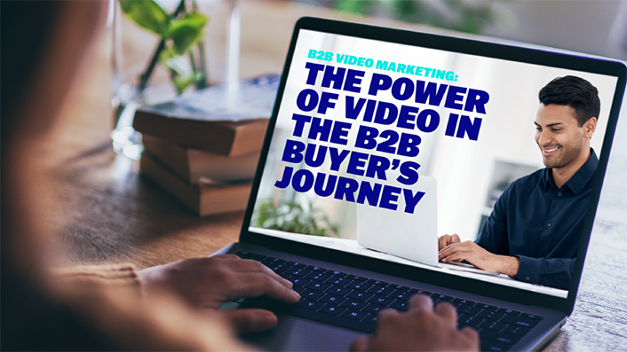 Person is reading the Brightcove report "B2B Video Marketing: The Power of Video in the B2B Buyer's Journey" on a laptop.
