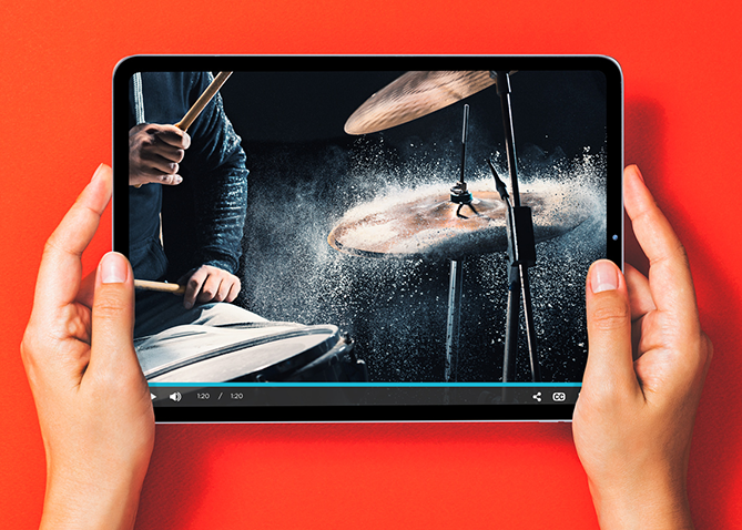 Video streaming on a tablet featuring a musician playing the drums