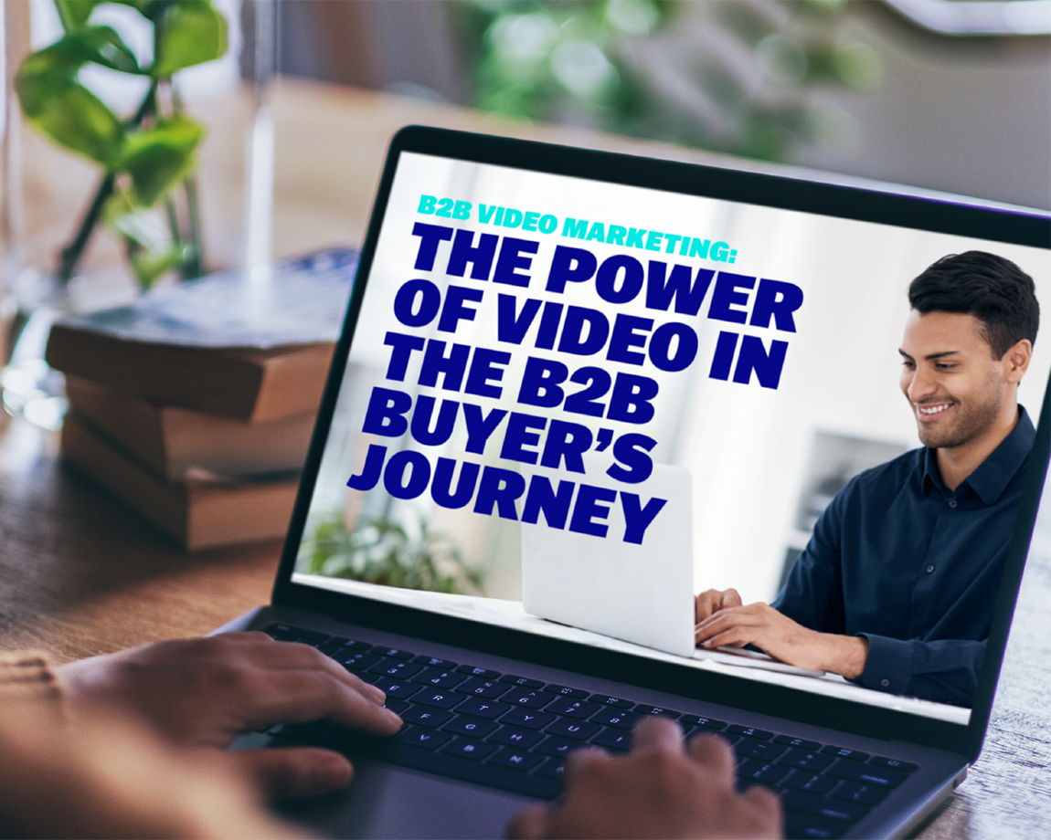 Person is reading the Brightcove report &#x22;B2B Video Marketing: The Power of Video in the B2B Buyer&#x27;s Journey&#x22; on a laptop.