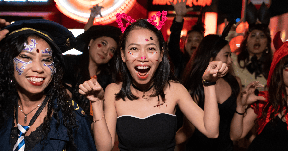 <figcaption class="wp-element-caption">In Tokyo, Halloween bursts with neon excitement as costumed revelers flood the streets. <em>Image credit: Satoshi-K/Gettyimages</em></figcaption>