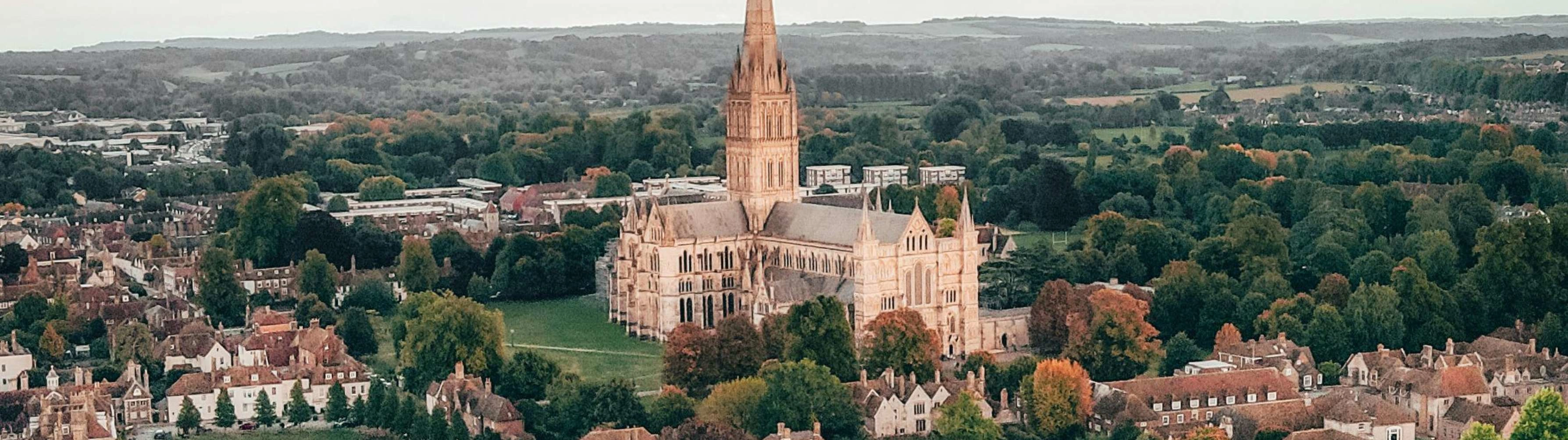 A beautiful church in Norwich, surrounded by greenery.