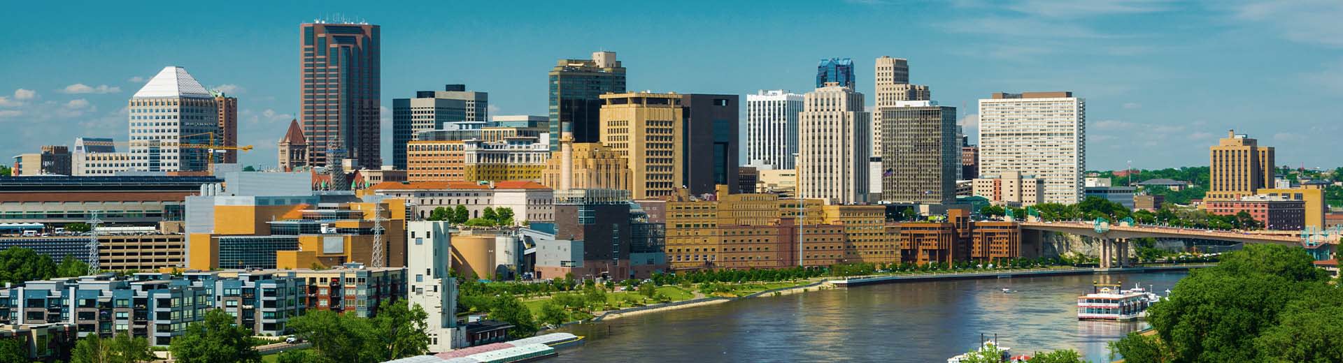 The square and imposing skyscrapers of St Paul on a clear day.