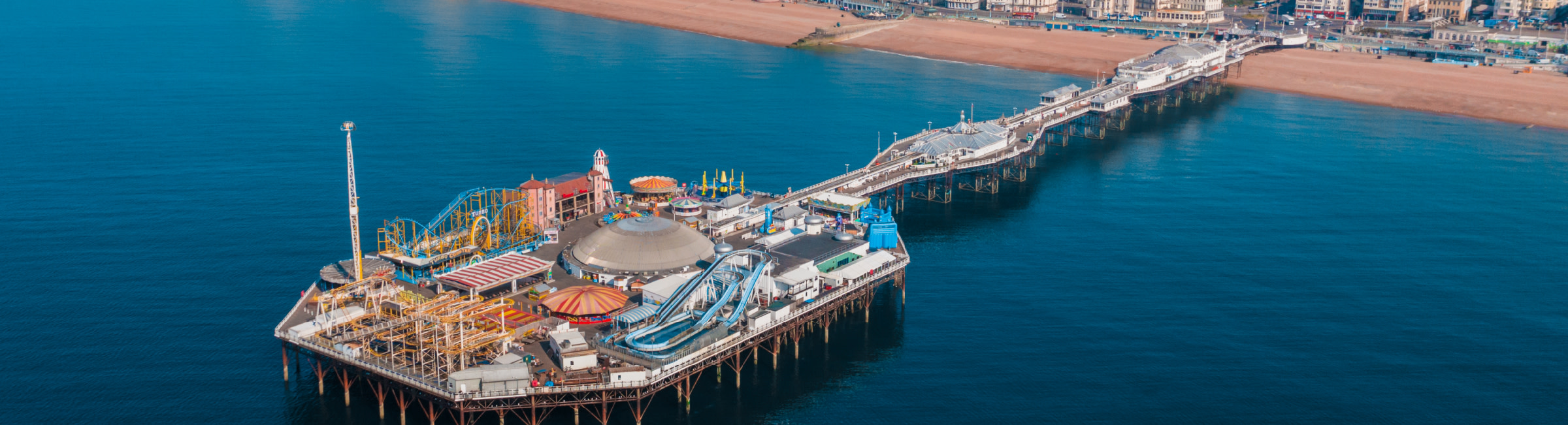 The world-famous Brighton Pier on a sunny day.