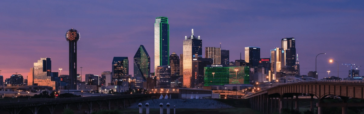 <figcaption>The Downtown Dallas skyline. <em>Image credit: Max Fray/Unsplash</em></figcaption>