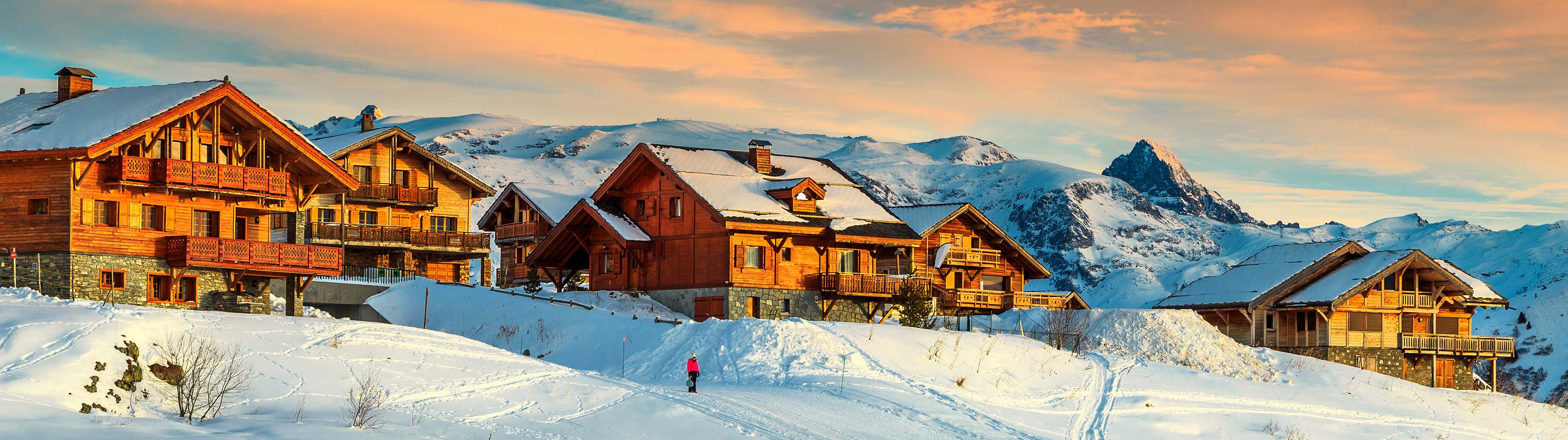 The beautiful chalets of Alpe d'Huez during sunset or dawn.