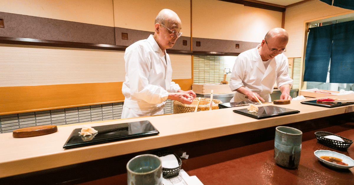 <figcaption class="wp-element-caption">Jiro Ono and his son. <em>Image credit: Wikimedia</em></figcaption>