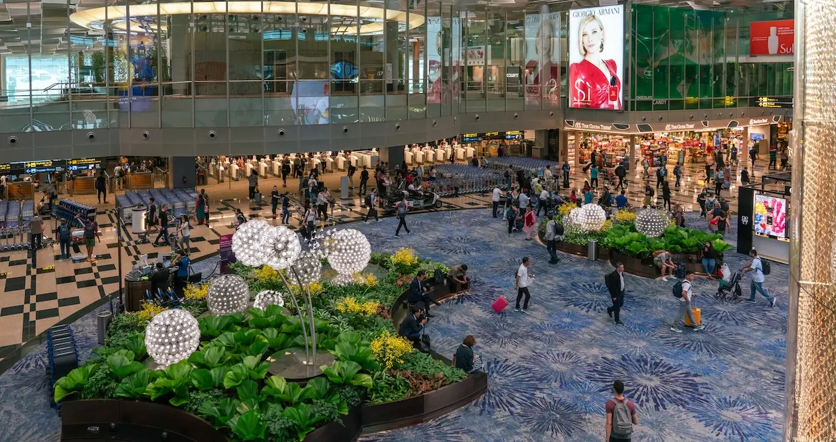 Shot of the departure area with shops and restaurants in Changi Airport in Singapore.