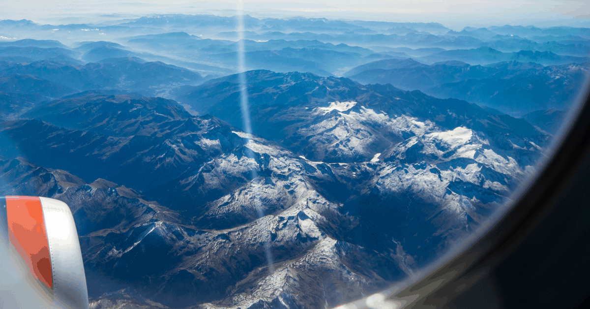 <figcaption>A view to the snow-capped peaks of the Alps of Italy and Austria.<em> Image credit: ClaireLucia</em></figcaption>