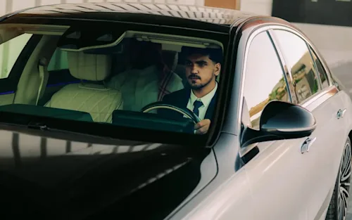 Chauffeur drives a Mercedes EQS for Blacklane.