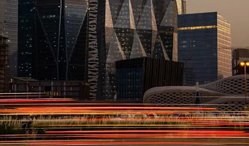 A slow-capture of a cityscape at sunset.