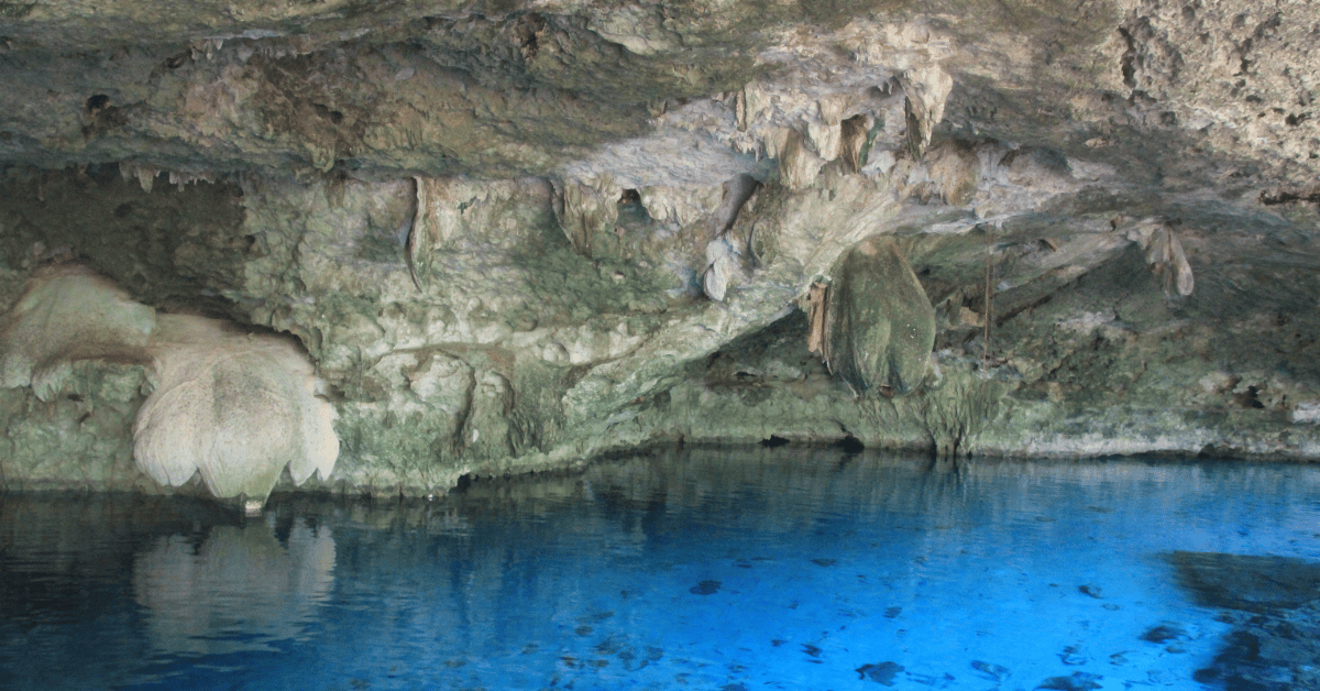 <figcaption class="wp-element-caption">Dos Ojos Cenote, Tulum, Mexico. <em>Image credit: Wikimedia</em></figcaption>