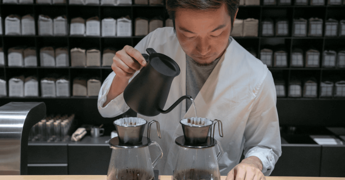 <figcaption class="wp-element-caption">Barista at Koffee Mameya, Tokyo. <em>Image credit: Wikimedia</em></figcaption>