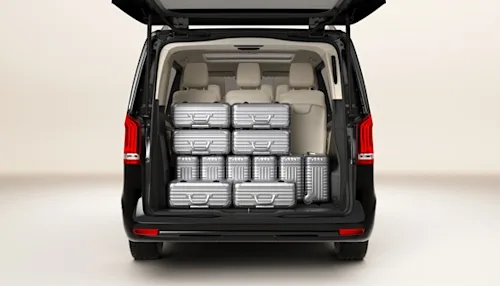 Rear view of the Blacklane Business Van class, showing a Mercedes V-Class van filled with suitcases.