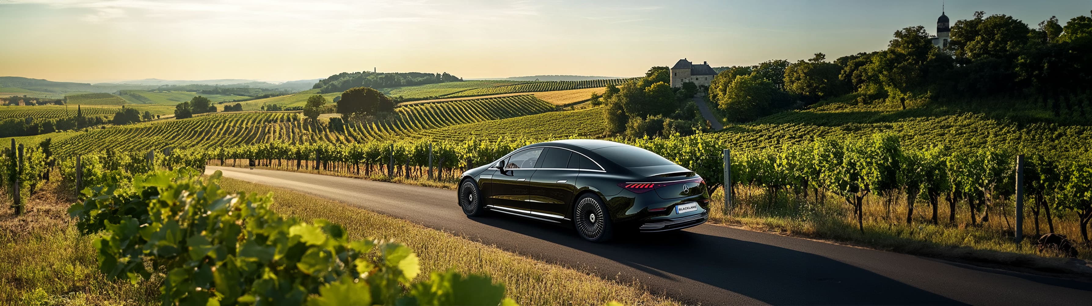 A Blacklane Mercedes limo speeds through Champagne vineyards on the way from Paris to Reims.