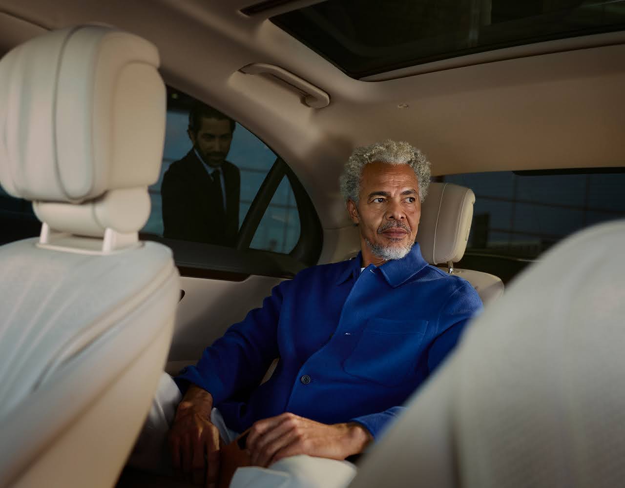 A passenger sits in the back seat of a Blacklane limo.
