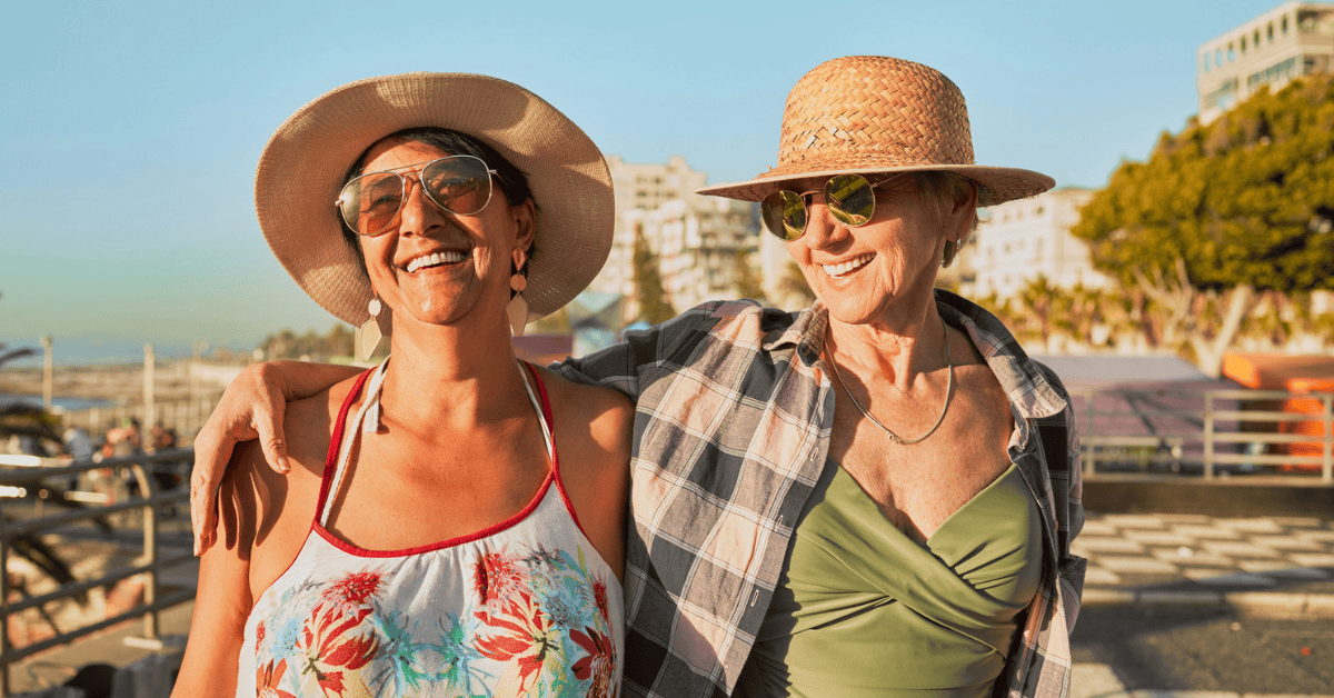 <figcaption class="wp-element-caption">Finding bliss in the warmth of the sun and the laughter of friends. <em>Image credit: PeopleImages/Getty Images</em></figcaption>