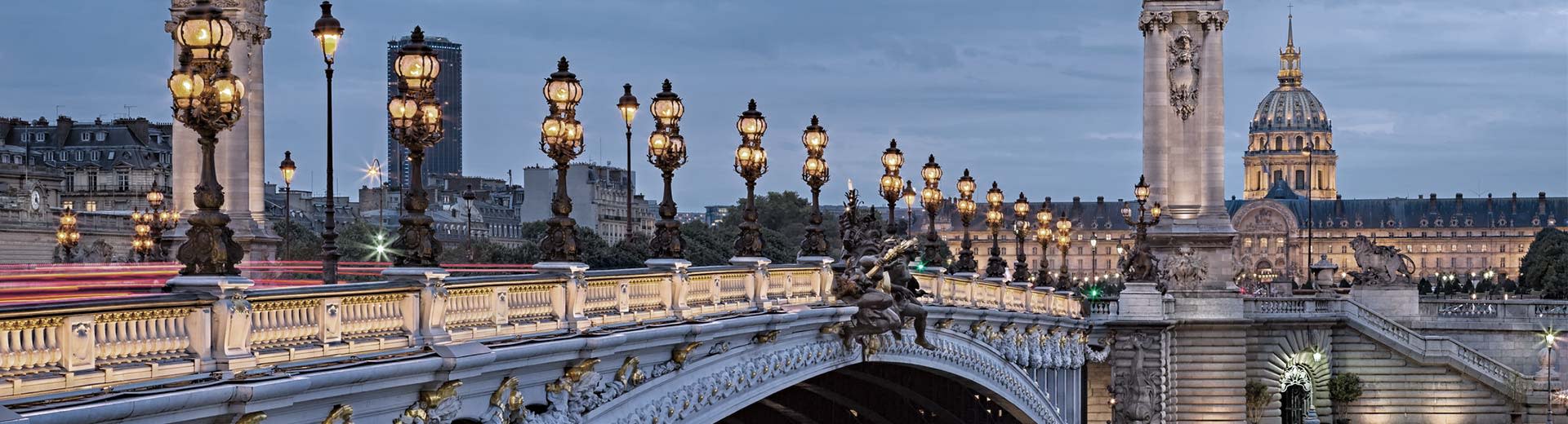 A beautiful bridge in Paris in the light of dusk or dawn.