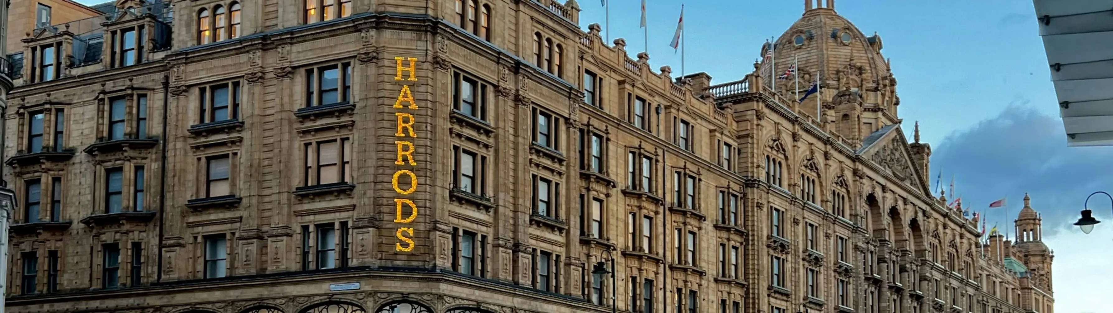 The iconic exterior and sign of Harrods department store in London.