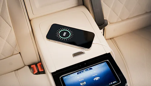 Shot of a phone charging in the interior of a Blacklane First Class vehicle.