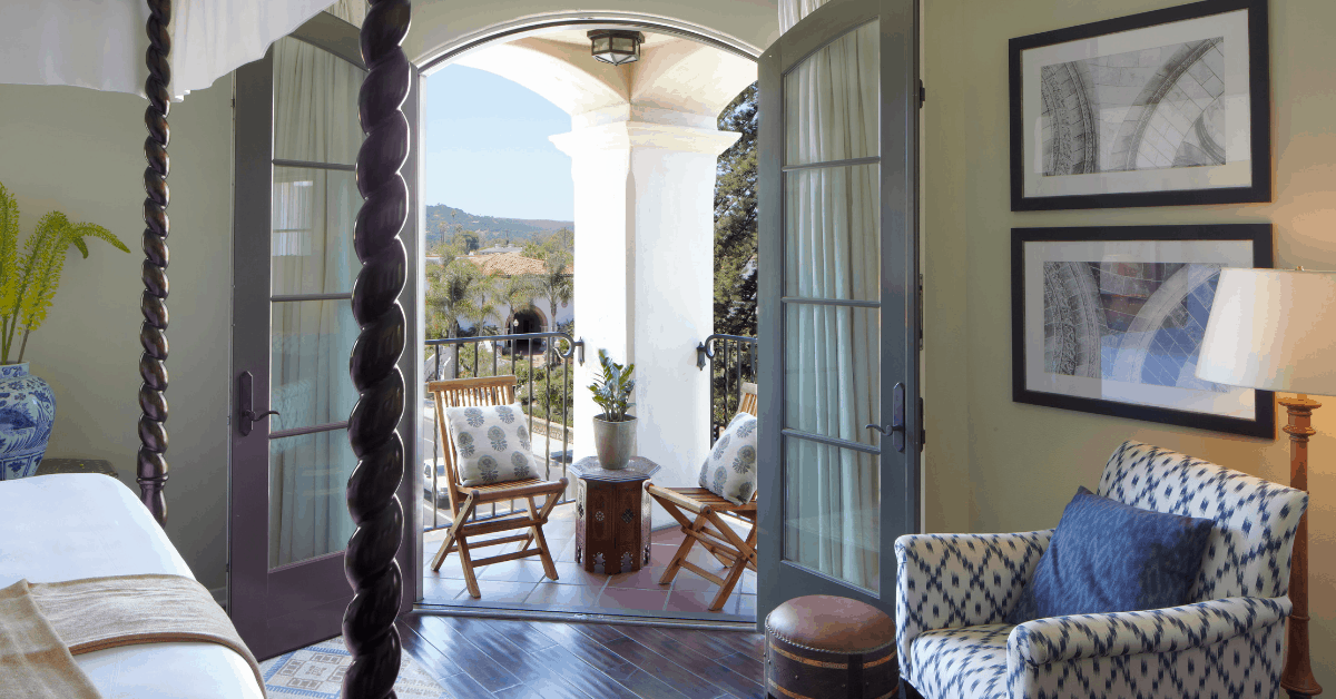 <figcaption class="wp-element-caption">Take in the views from your four-poster bed. <em>Image credit: Kimpton Canary Hotel</em></figcaption>