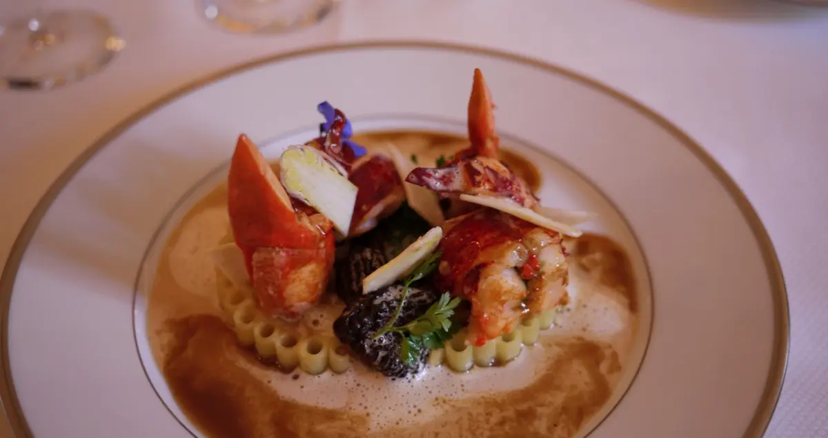 Close-up shot of an ornate dish of food at Parisian fine dining restaurant L'Ambroise.