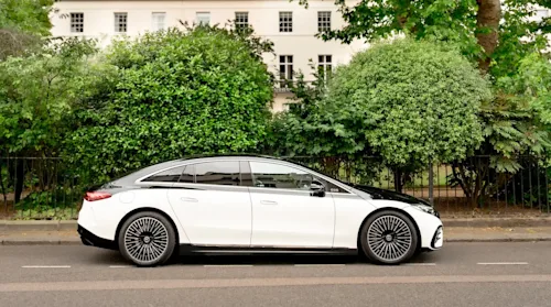 A two-tone Blacklane Mercedes parked outside a park in London's Mayfair.