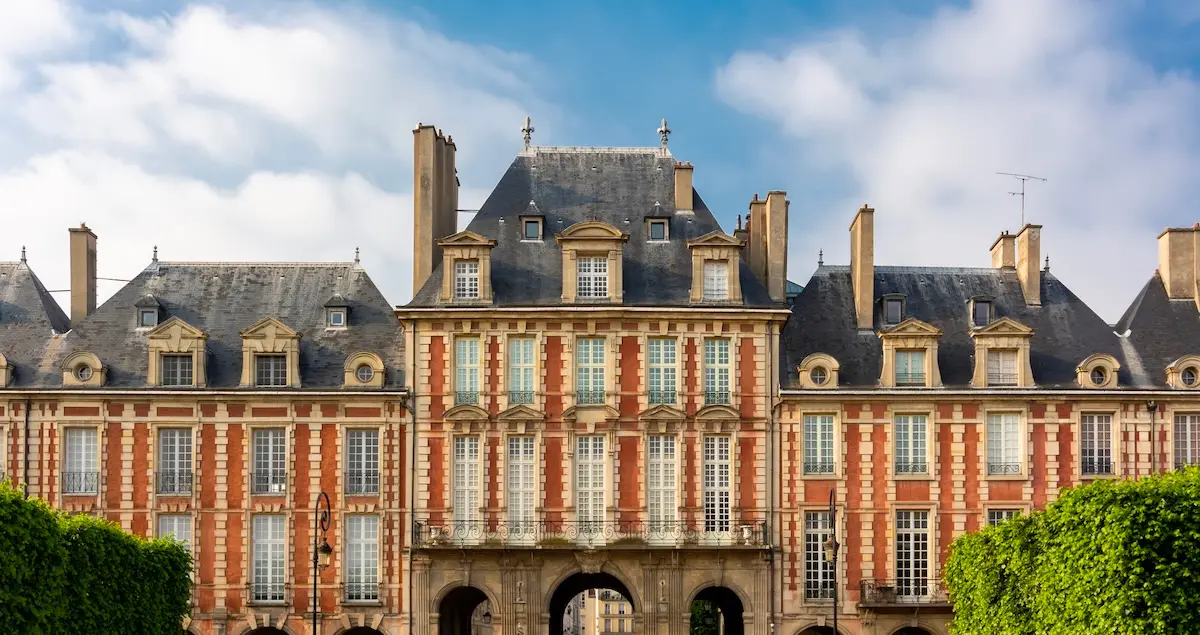 Exterior of the grand buildings at Place des Vosges in Paris