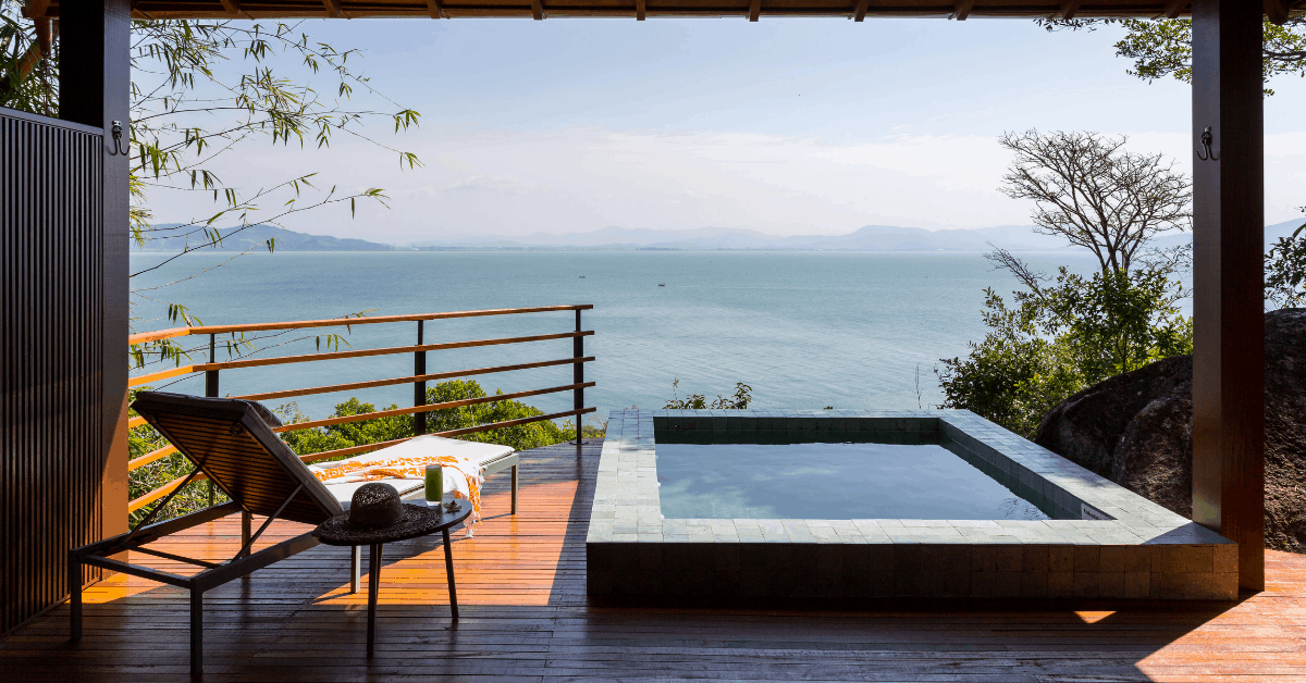 <figcaption>Ponta dos Ganchos boasts sweeping ocean views from its resort.  I<em>mage credit: Ponta dos Ganchos</em></figcaption>