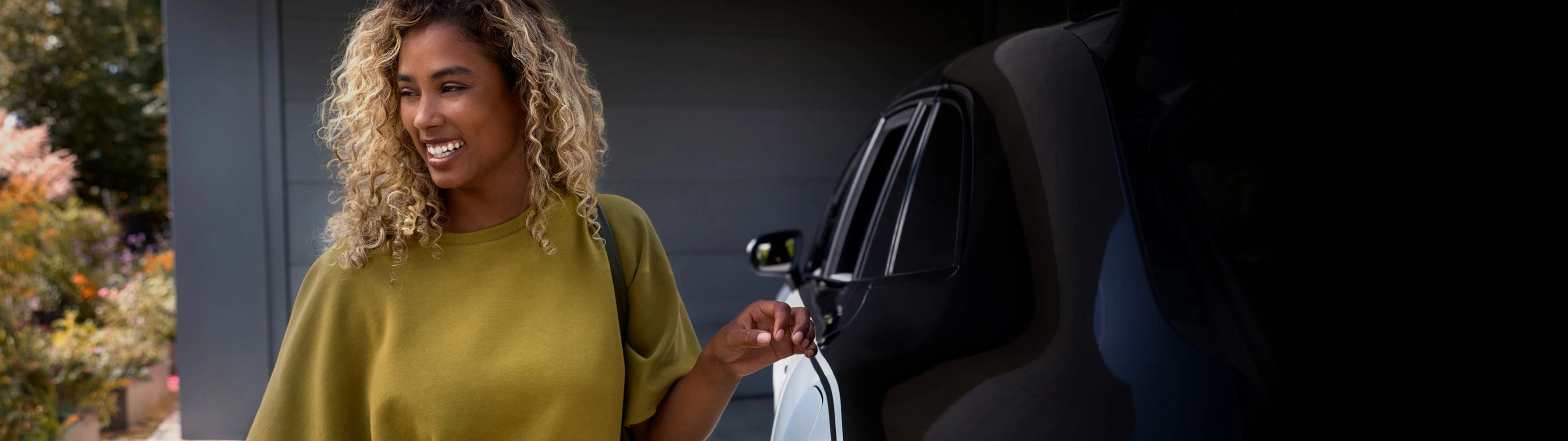 A woman relaxes in the back seat of her Blacklane limousine service.