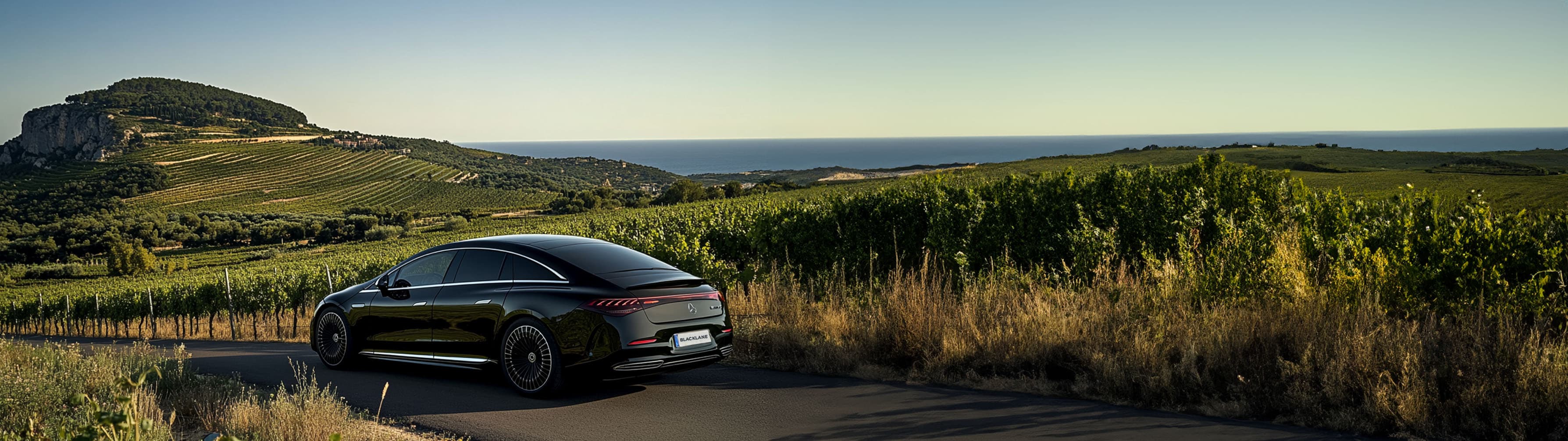 A Blacklane Mercedes limo travels past vineyards from Marseille to Châteauneuf-du-Pape.