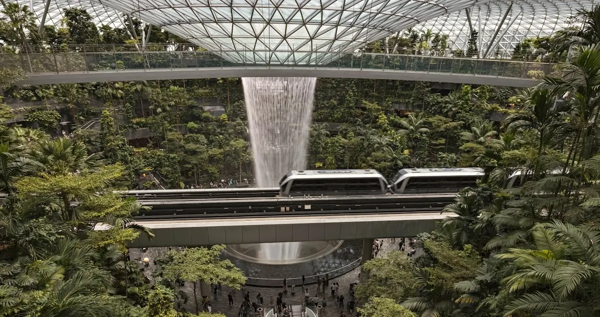 Shot of the Jewel Rain Vortex waterfall and the shuttle monorail running across it in the Changi airport, Singapore.