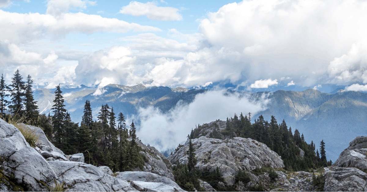 <figcaption>Clouds above the Rocky Mountains summit.<em> Image credit: divampo/iStock</em></figcaption>