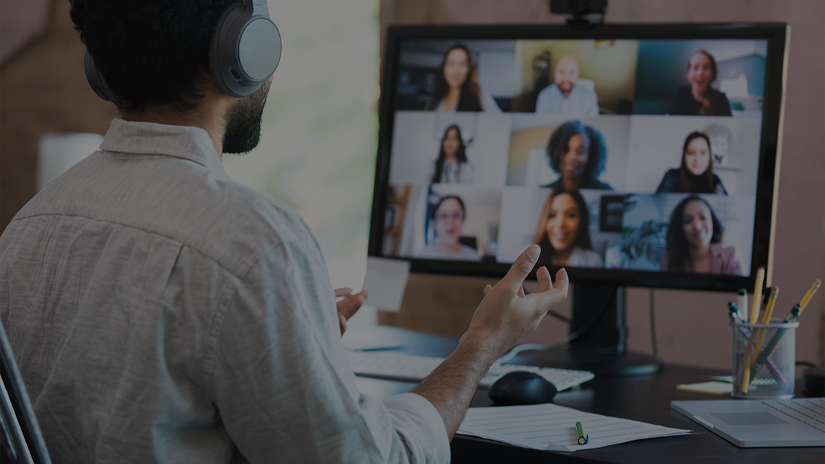 Man on a video conference call with many people.