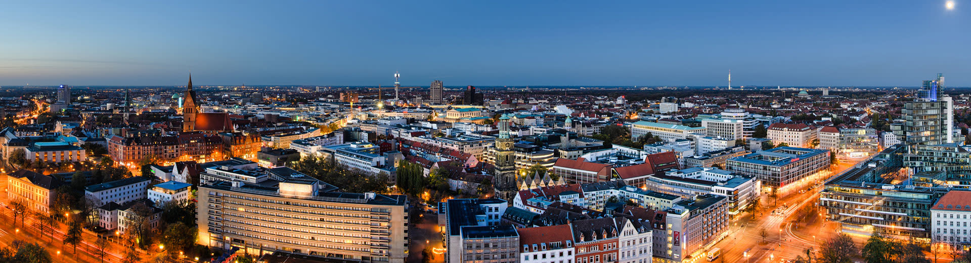 An aerial viw of Hanover at night, with a combination of old and new buildings.